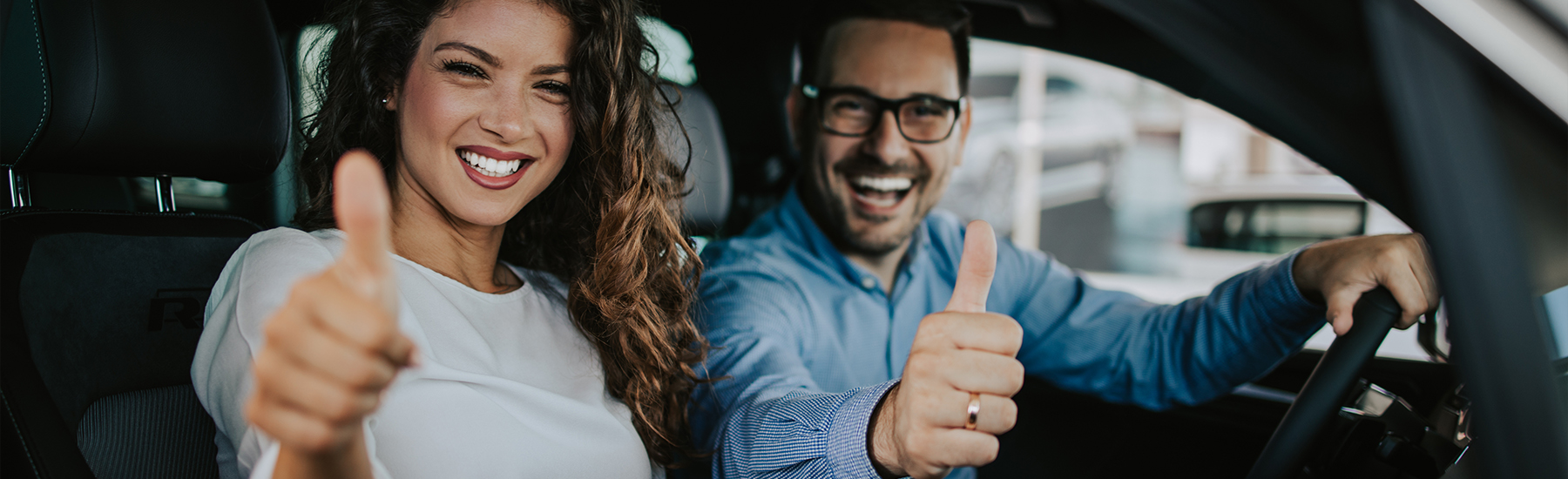 happy couple buying new car
