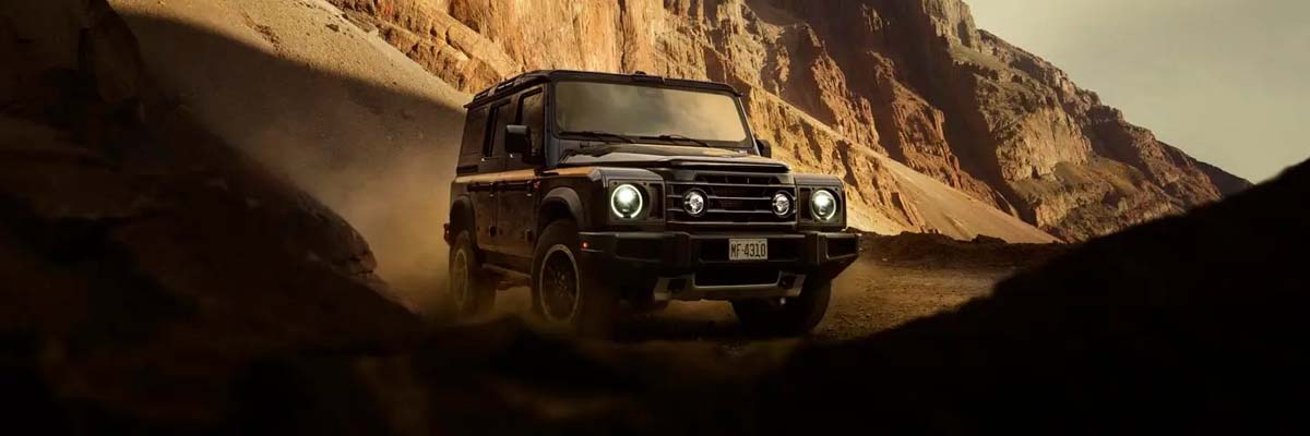 Exterior shot of a INEOS near mountains.