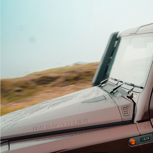 Up close shot of INEOS Grenadier in queens red paint option